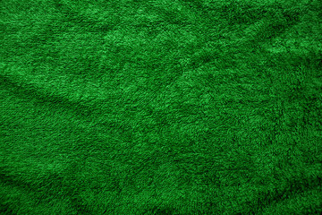 Crumpled green fabric, top view, fleecy texture, fabric background for advertising