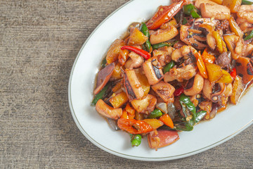 Tumis cumi or stir-fried squid. indonesia food made from squid, garlic, chili and other ingredients. has a savory and spicy taste and has good nutritional content for the body