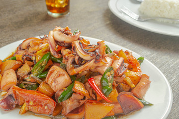 Tumis cumi or stir-fried squid. indonesia food made from squid, garlic, chili and other ingredients. has a savory and spicy taste and has good nutritional content for the body