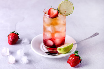 Glasses of Strawberries and Lime Ice Tea Refreshing Healthy Summer Drink Light Gray Background Horizontal