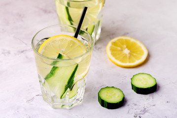 Glasses of Healthy Detox Water with Lemon and Cucumbers Diet Drink Straw Horizontal Above