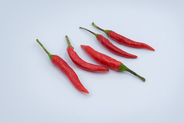 Group of five chili peppers isolated on white background as package design element