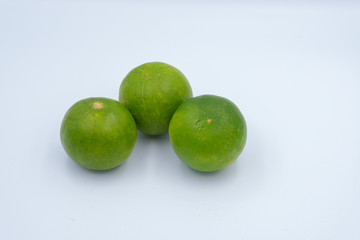 green lemon isolated from white background