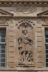 Fototapeta na wymiar Architectural fragments of Old French house. Saint-Antoine Street, Paris, France.