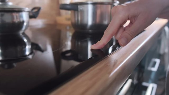 Woman touches and presses the sensor button