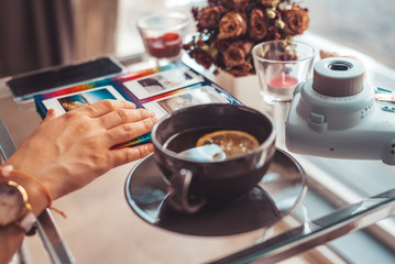 Paper photo on table with morning tea