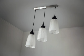 three lamps in the white room