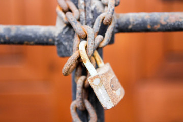 Rusty padlock. Iron chain. Rusty metal.