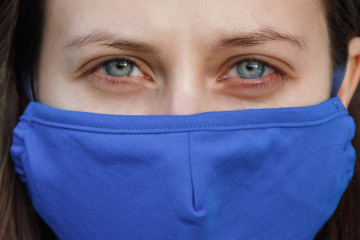 Woman wears a mask due to a virus outbreak in the city, coronovirus, epidemic