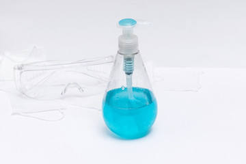 gel soap sanitizer background coronavirus covid 19 dispenser white blue medical glasses