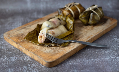 Sticky rice and banana wrap banana leaf bundle rope and Boil in boiling water( KhaoTomMat)