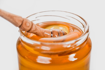 golden yellow transparent fresh honey in bottle
