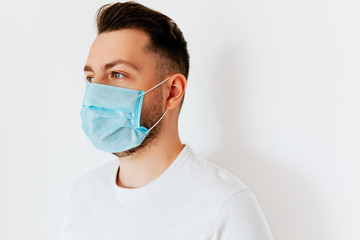 A young european man wearing protective mask  to prevent infection, airborne respiratory illness such as flu, Covid-19. Avoid contaminating Corona virus
