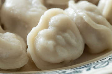 Fototapeta na wymiar Russian dumplings pelmeni in the plate
