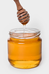 golden yellow transparent fresh honey in bottle