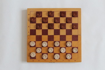 Checkers on a checkerboard on a light background