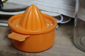Orange plastic vintage orange citrus squeezer hand press