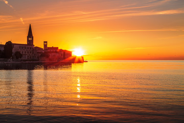 View on a historic center of Porec town and sea at sunset, Croatia, Europe.