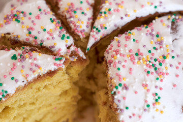 Sweet Easter cake cut with a knife into pieces. Close-up