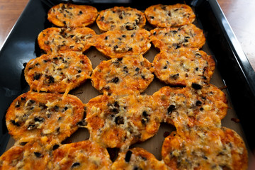 homemade hot sandwiches cooked with hands with different fillings lie in a protvin,quick sandwiches at home,fast food at home,vegetarian and meat sandwiches on one tray