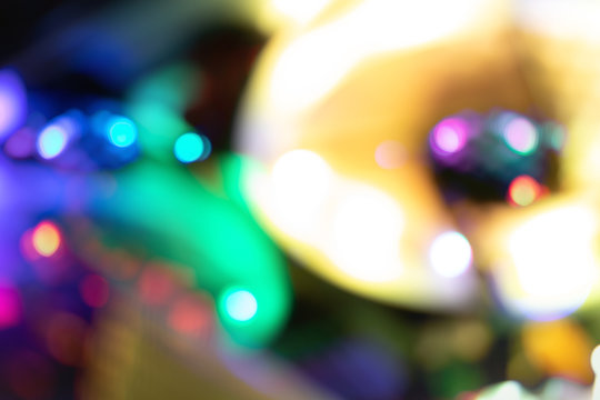 blurred bokeh defocused colorful lights of computer. Abstract beautiful background on dark.