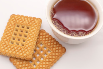 Cup of tea with cookies on a white background