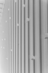 High resolution white abstract background for graphic design,  application design.Volume diagonal lines.Soft convex wall panels, in light gray leather. High quality seamless realistic texture.