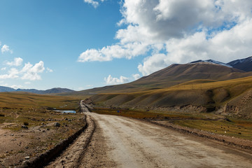 Fototapeta premium A 367 highway passing in the Naryn region of Kyrgyzstan.