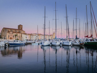 Fototapeta na wymiar Sunset at old harbor in french city La Ciotat