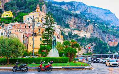 Traffic on road at Amalfi town in autumn reflex
