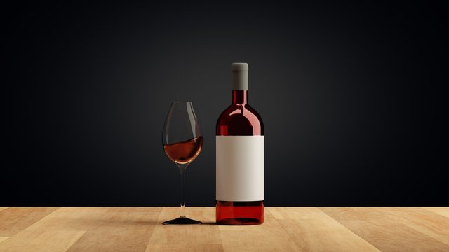 Glass and bottle with delicious red wine on table against wooden background