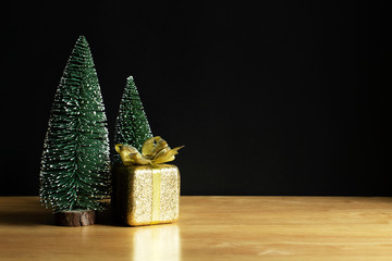 Christmas decoration object on wood table with black background. Christmas holiday celebration and new year concept. copy space