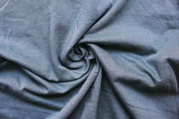 Grey wrinkled cloth texture pattern. Crumpled light pale gray textile, soft linen sheets close up...
