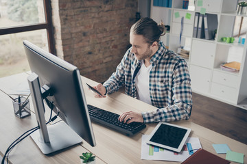 Photo of handsome business administrator guy computer monitor table reading telephone client...