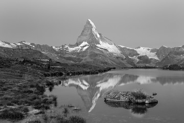 Sunrise view on iconic mountain Matterhorn and Stellisee lake in Valais region, Switzerland, Europe