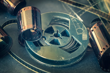 Old dirty movie coil and photographic films. Vintage background, retro style. Photo, movie, cinema...
