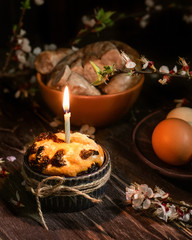 Easter table with Easter cake, homemade sausage and homemade eggs.
Happy easter holiday. Dark background, festive atmosphere.