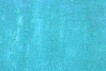 Beautiful vintage blue background with old blue paint with a rough surface, streaks and uneven texture of blue paint on an old rough surface