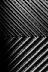 black and white embossed texture of parallel lines,plastering of white concrete wall in seamless black line embossed patterns for background, texture abstract