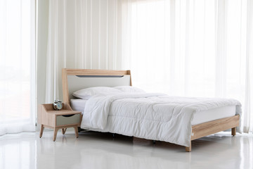 Wooden bed, white mattress, white curtain