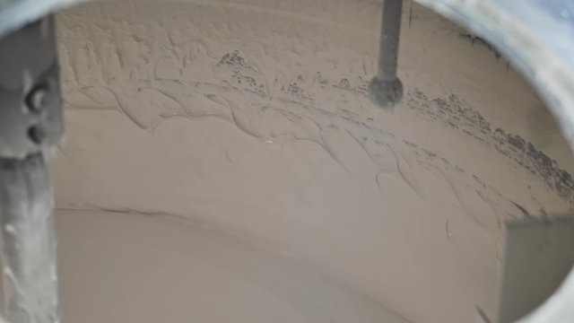 Toothpaste production process.  Close up of mixing toothpaste in a large  steel production container.