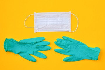 Surgical protective mask and medical gloves on the Yellow background. Healthcare medical Coronavirus quarantine, Concept Of Air pollution or allergy, flat lay banner, top view, copy space