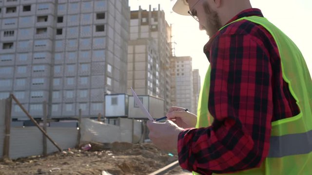 Civil engineer checking work for communication to management team in the construction site