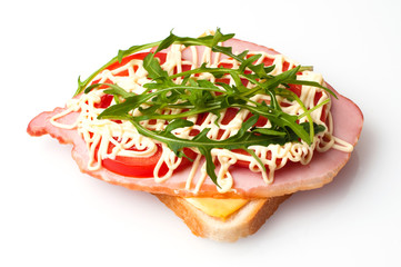 Sandwich of bread for toast, sturgeon, tomatoes, arugula, cheese and mayonnaise on a white background view from the top flat lay