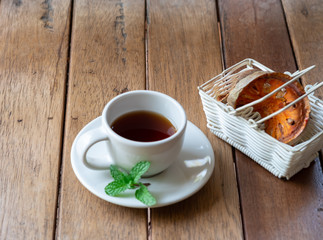 Hot Bael Herbal Tea Fruits, herbs for health on the wood floor.
