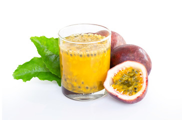 Fresh passion fruit juice in glass with green leaf isolated on white background, fruit healthy concept