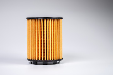 The filter element of a new oil filter. New spare parts for an internal combustion engine. Filter insert