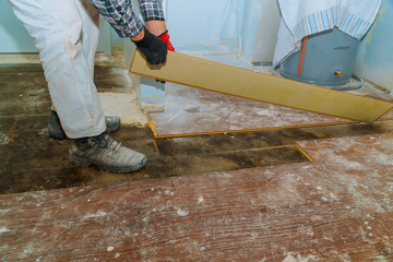 Demolish of old wooden parquet floor with home renovation