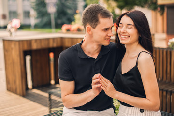 Loving couple hugging in the street.