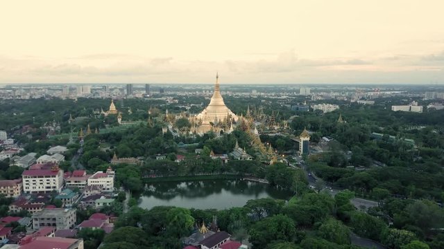 Yangon (Shwedagon pagoda) at sunset by drone in 4K. Over the city forward movement.
